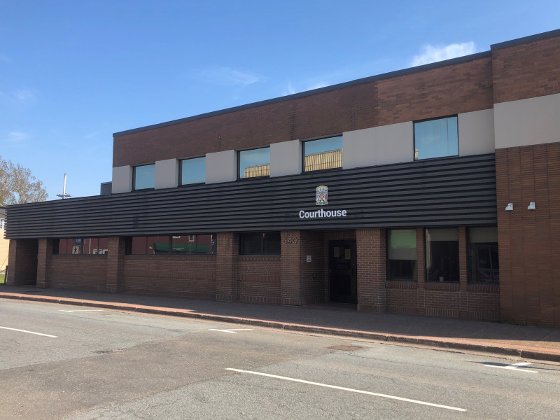 Brick professional centre with a courthouse sign over the front entrance. 