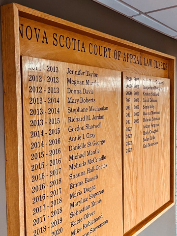 Wood plaque with the names of law clerks at the Court of Appeal. 