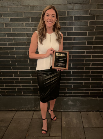 A photo of Jennifer Stairs posing with the Canadian Media Lawyers Association’s Freedom of Expression Award