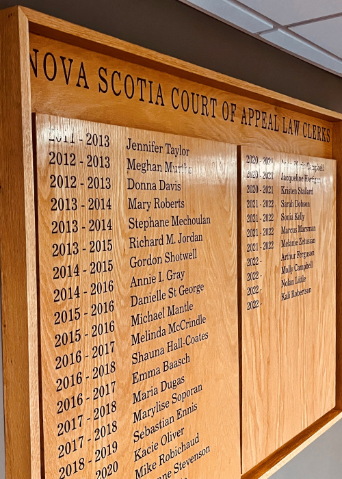Wood plaque with the names of law clerks at the Court of Appeal. 