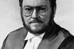 A black and white portrait photo of the late Judge Robert White