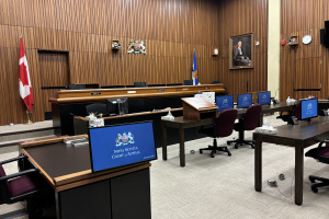 A photo of a Nova Scotia Court of Appeal courtroom. The computer screens show the Court's emblem and the words Nova Scotia Court of Appeal.