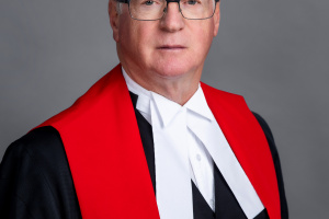 A portrait of the Honourable Glen McDougall, Justice of the Supreme Court of Nova Scotia